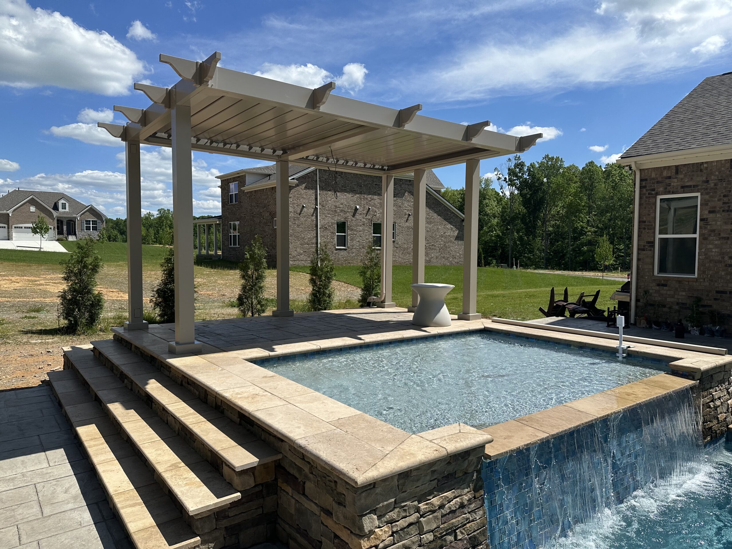 louvered pergola by pool